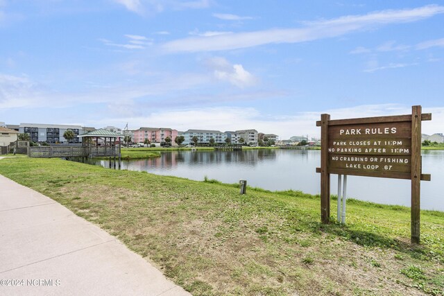 view of dock with a gazebo and a residential view