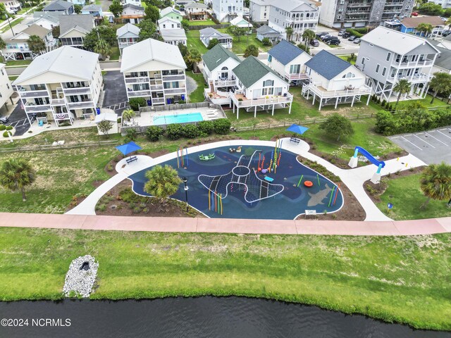 dock area featuring a view of the beach and a water view