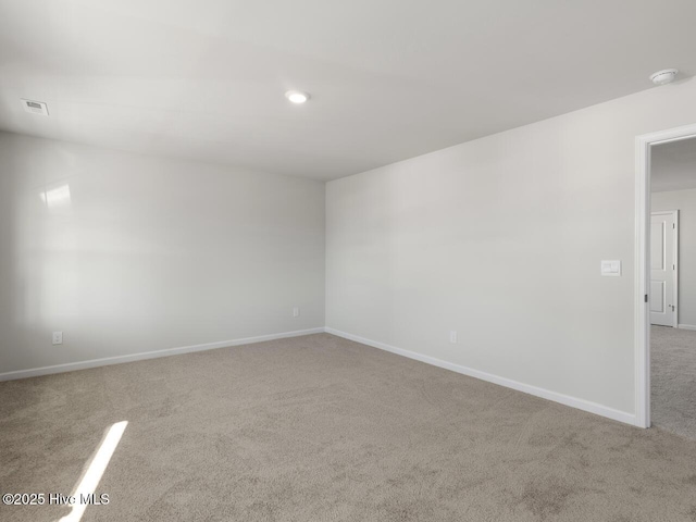 empty room featuring light colored carpet