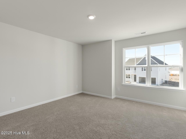 unfurnished room with carpet flooring