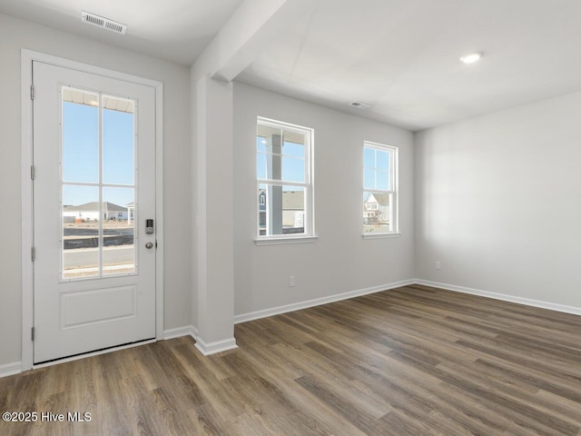 entrance foyer with dark hardwood / wood-style floors