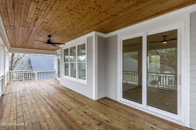 wooden terrace featuring ceiling fan