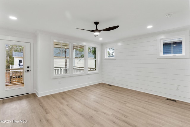 interior space with light hardwood / wood-style floors and ceiling fan