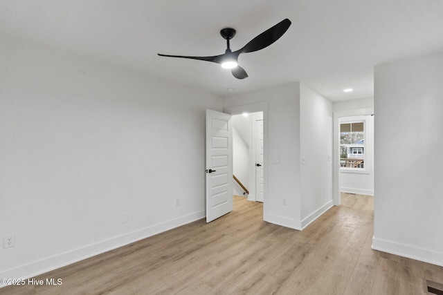 spare room featuring ceiling fan and light hardwood / wood-style floors