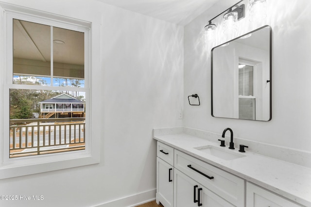 bathroom featuring vanity and a wealth of natural light