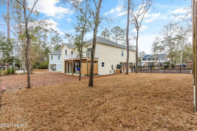 back of house featuring a deck