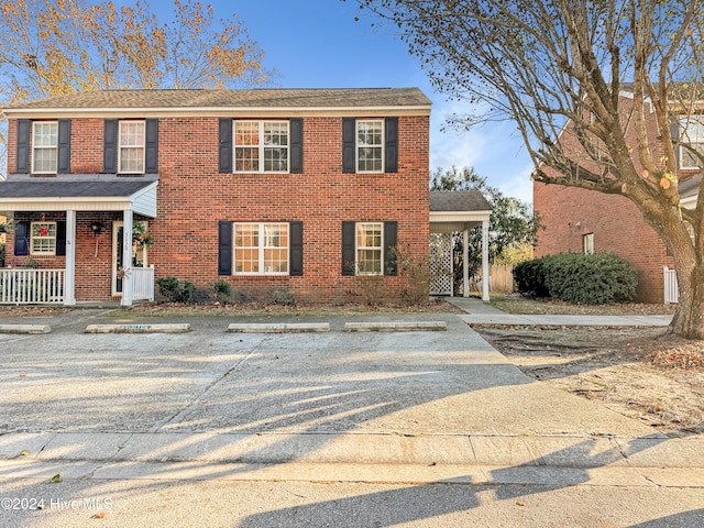 view of front facade featuring covered porch and central AC unit