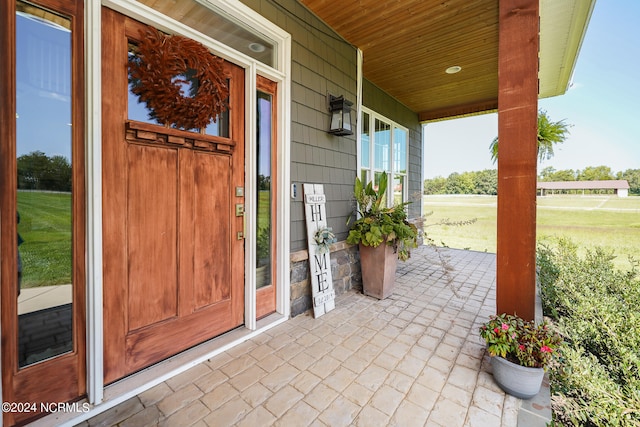 property entrance with covered porch