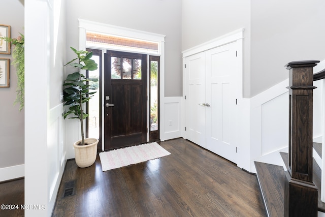 entrance foyer featuring dark hardwood / wood-style floors