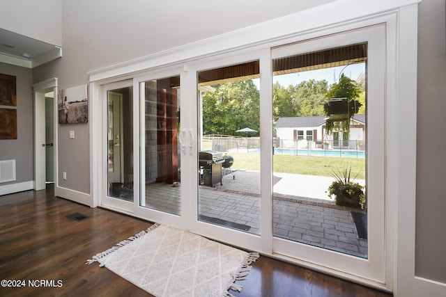 doorway to outside featuring dark hardwood / wood-style flooring