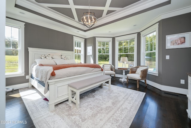 bedroom with an inviting chandelier, multiple windows, and coffered ceiling