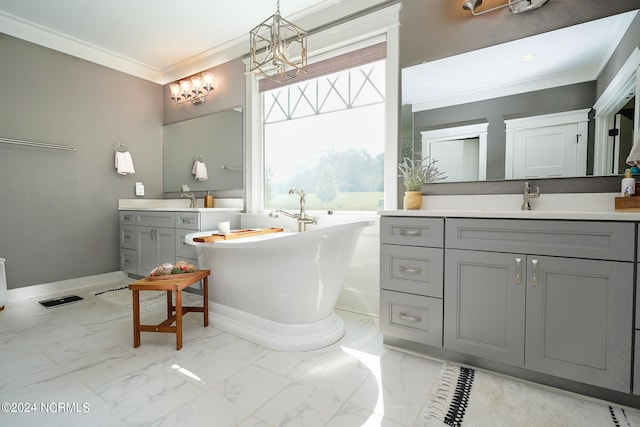 bathroom with a tub to relax in, vanity, and ornamental molding