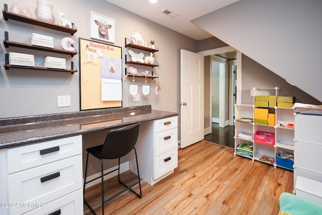 office space with light hardwood / wood-style flooring