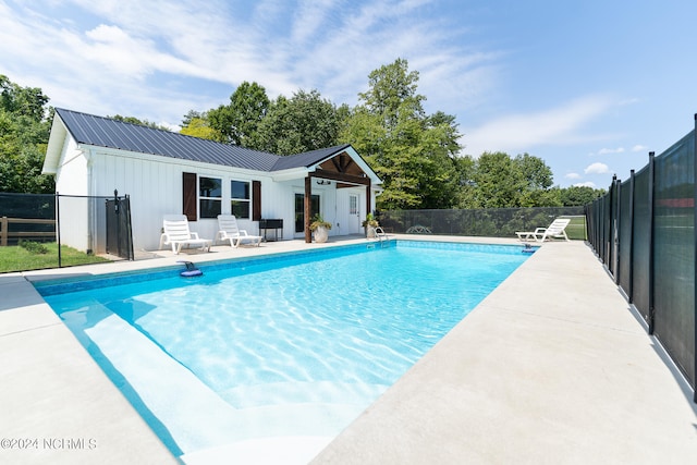 view of swimming pool with a patio area