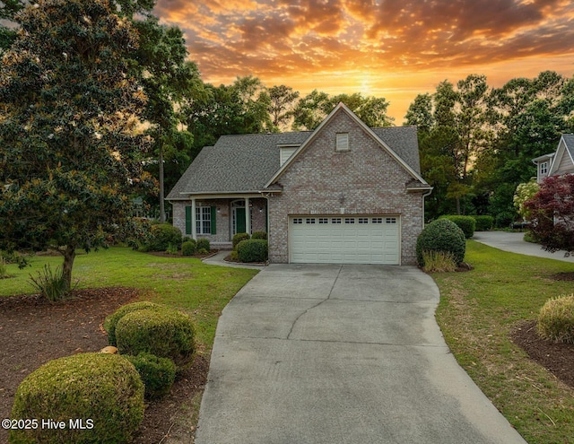 2788 Creek Bridge Ct, Southport, NC 28461 - traditional-style house featuring concrete driveway, brick siding, and a yard