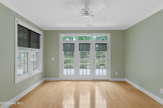 2788 Creek Bridge Ct, Southport, NC 28461 - spare room featuring light wood finished floors, baseboards, crown molding, and a ceiling fan
