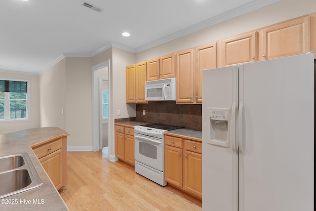 2788 Creek Bridge Ct, Southport, NC 28461 - kitchen with white appliances, light brown cabinets, light wood finished floors, recessed lighting, and ornamental molding