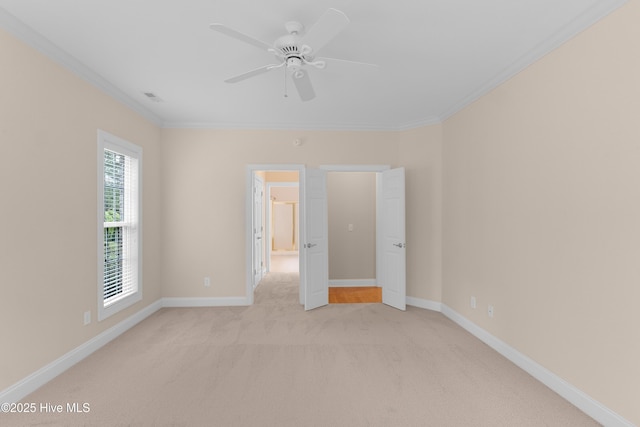 2788 Creek Bridge Ct, Southport, NC 28461 - spare room with ornamental molding, light carpet, baseboards, and a ceiling fan