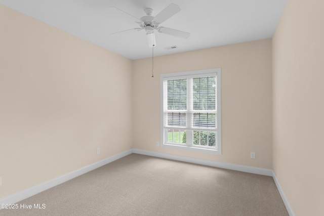2788 Creek Bridge Ct, Southport, NC 28461 - empty room featuring baseboards, light colored carpet, and ceiling fan