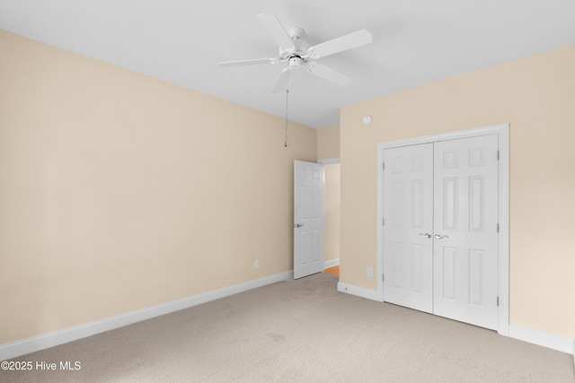 2788 Creek Bridge Ct, Southport, NC 28461 - unfurnished bedroom with light carpet, a closet, baseboards, and a ceiling fan