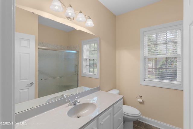 2788 Creek Bridge Ct, Southport, NC 28461 - bathroom featuring vanity, a shower stall, toilet, tile patterned floors, and baseboards
