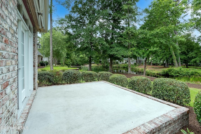 2788 Creek Bridge Ct, Southport, NC 28461 - view of patio featuring view of scattered trees