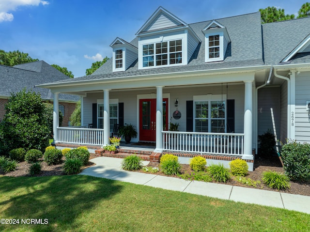 cape cod-style house featuring a porch