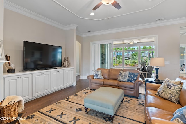 living room featuring crown molding, ceiling fan, and dark wood-type flooring