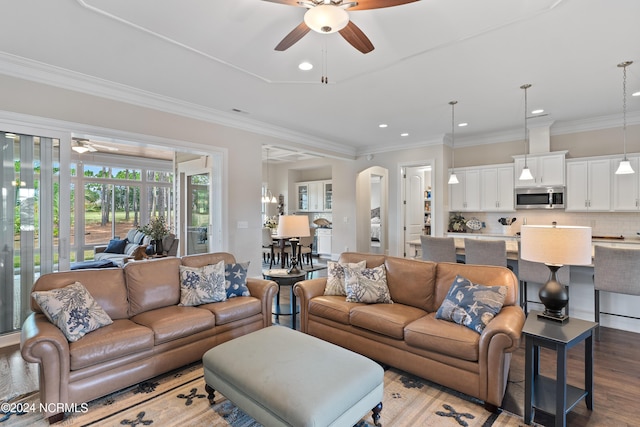 living room featuring ceiling fan, light hardwood / wood-style floors, and ornamental molding