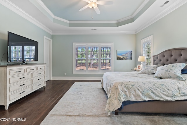 bedroom with ornamental molding, multiple windows, dark wood-type flooring, and ceiling fan