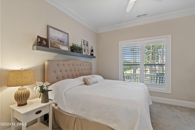 bedroom featuring carpet, ceiling fan, and crown molding