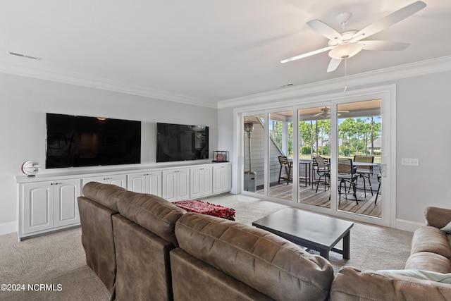 living room with light carpet, ceiling fan, and ornamental molding