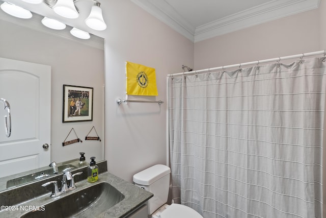 bathroom featuring vanity, toilet, curtained shower, and ornamental molding