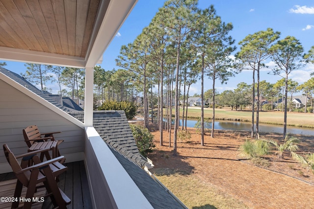 exterior space with a water view and a balcony