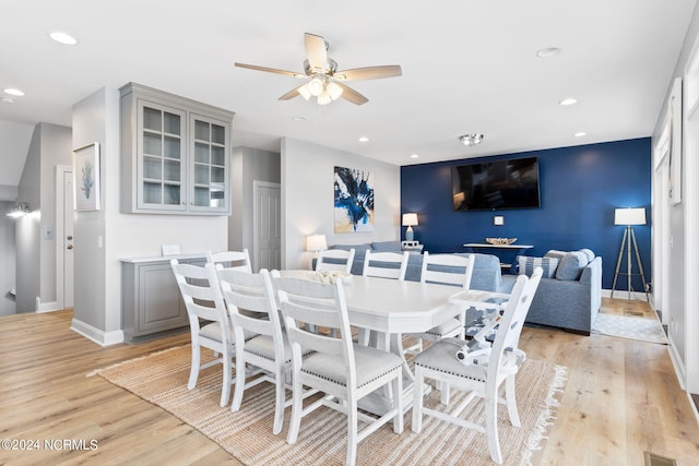 dining area featuring ceiling fan and light hardwood / wood-style floors