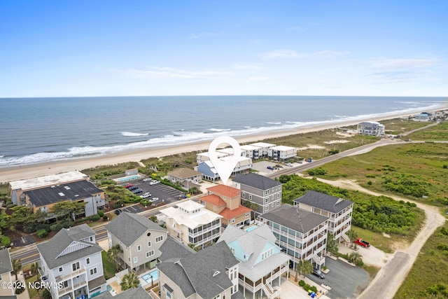 drone / aerial view with a beach view and a water view