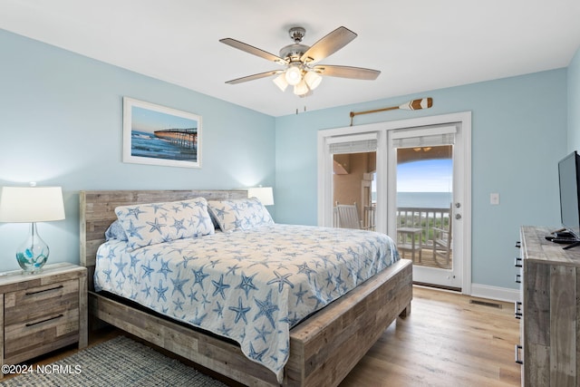 bedroom with light hardwood / wood-style flooring, ceiling fan, and access to exterior