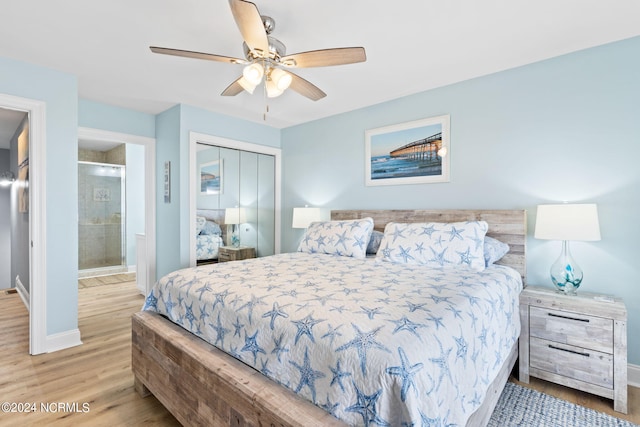 bedroom featuring ceiling fan, a closet, ensuite bath, and light hardwood / wood-style flooring