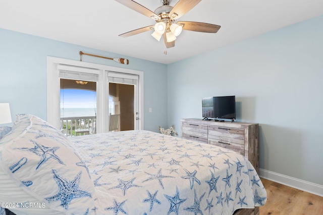 bedroom featuring ceiling fan, access to outside, and hardwood / wood-style floors