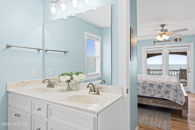 bathroom featuring ceiling fan, wood-type flooring, and vanity