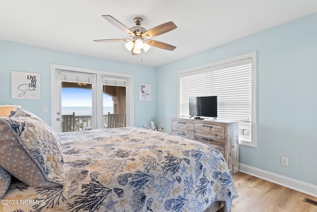 bedroom featuring ceiling fan, access to exterior, and hardwood / wood-style flooring