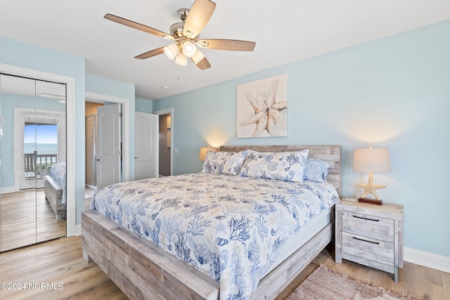 bedroom with ceiling fan, a closet, and light hardwood / wood-style floors