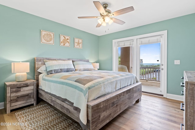 bedroom featuring hardwood / wood-style floors, access to outside, and ceiling fan