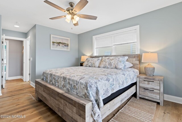 bedroom with light wood-type flooring and ceiling fan