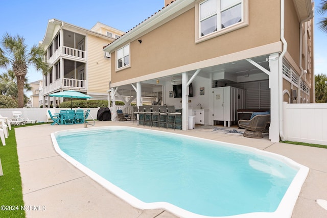 view of swimming pool featuring a patio area