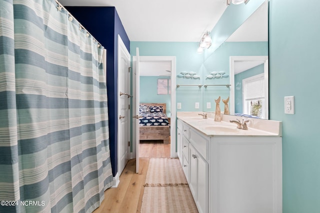 bathroom featuring hardwood / wood-style flooring and vanity