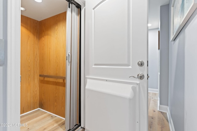 washroom with light hardwood / wood-style floors