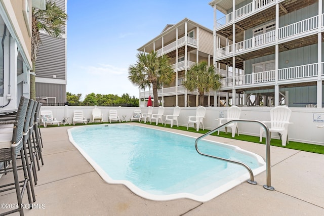 view of pool featuring a patio area