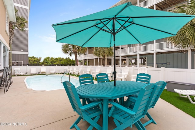 view of patio with a fenced in pool