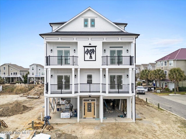 rear view of property featuring a balcony